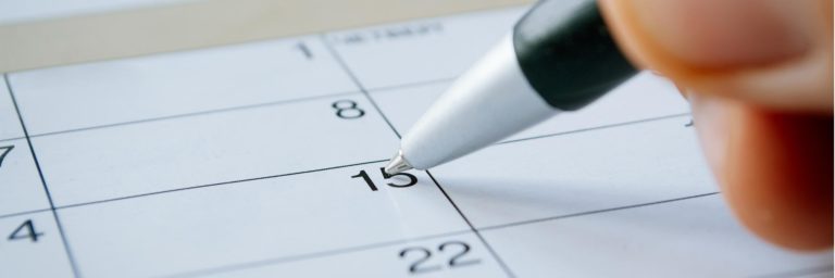pen marking on a date on a calendar