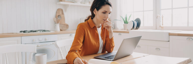 Pharmacy Transparency is Even More Important in 2026 - Woman looks at laptop
